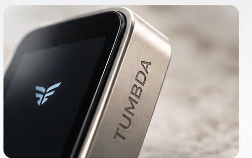Detail product image showing TUMBDA engraved into the hardware wallet body.